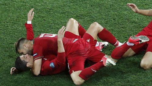 Portugal's Miguel Veloso congratulates Cristiano Ronaldo in front of team mate Custodio as they celebrate their second goal against Netherlands during their Group B Euro 2012 soccer match in Kharkiv